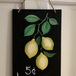 E24  Lemons on Chalkboard Sign